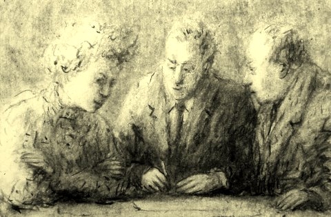 drie personen aan een tafel